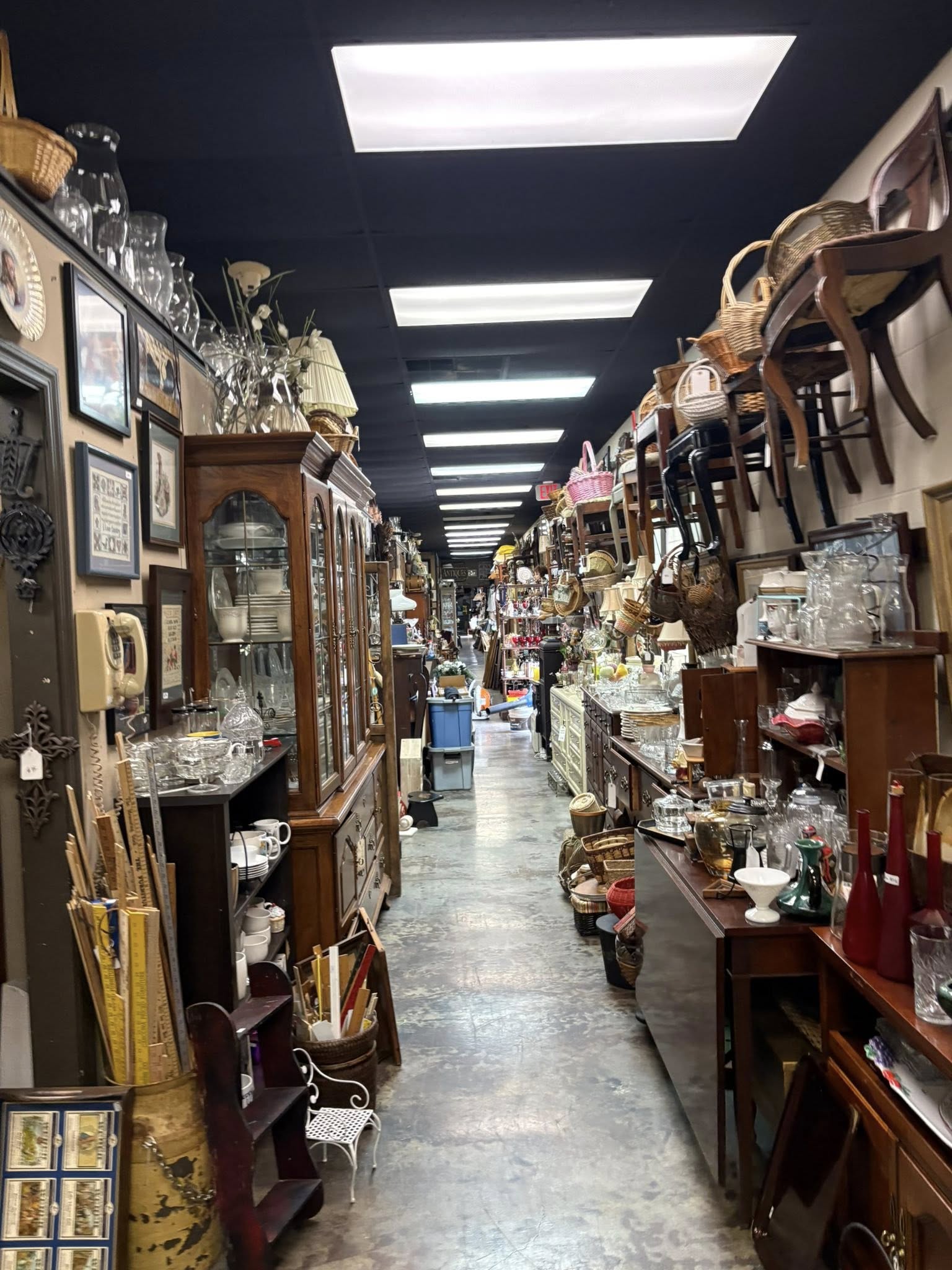 A long aisle of antiques and vintage finds inside Vintiques